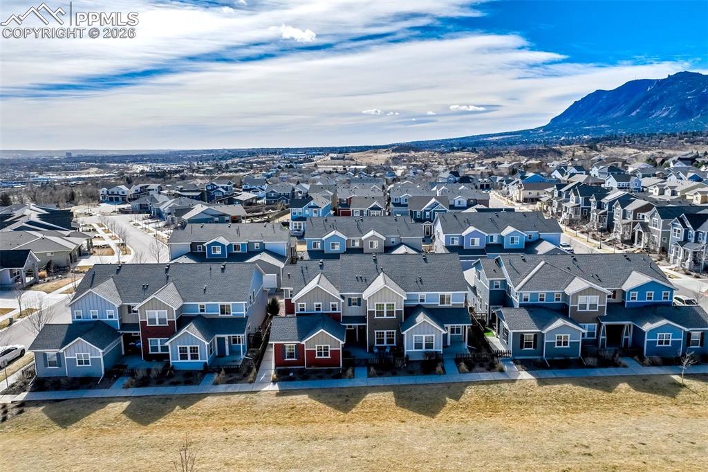 Image 42 of 48: Aerial perspective of the townhome(in the centre cluster) looking to the ea