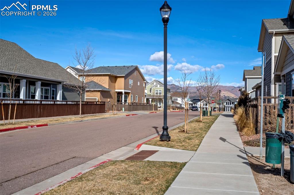 Image 46 of 48: Showing the sidewalks, lights and mountain views in this walkable community