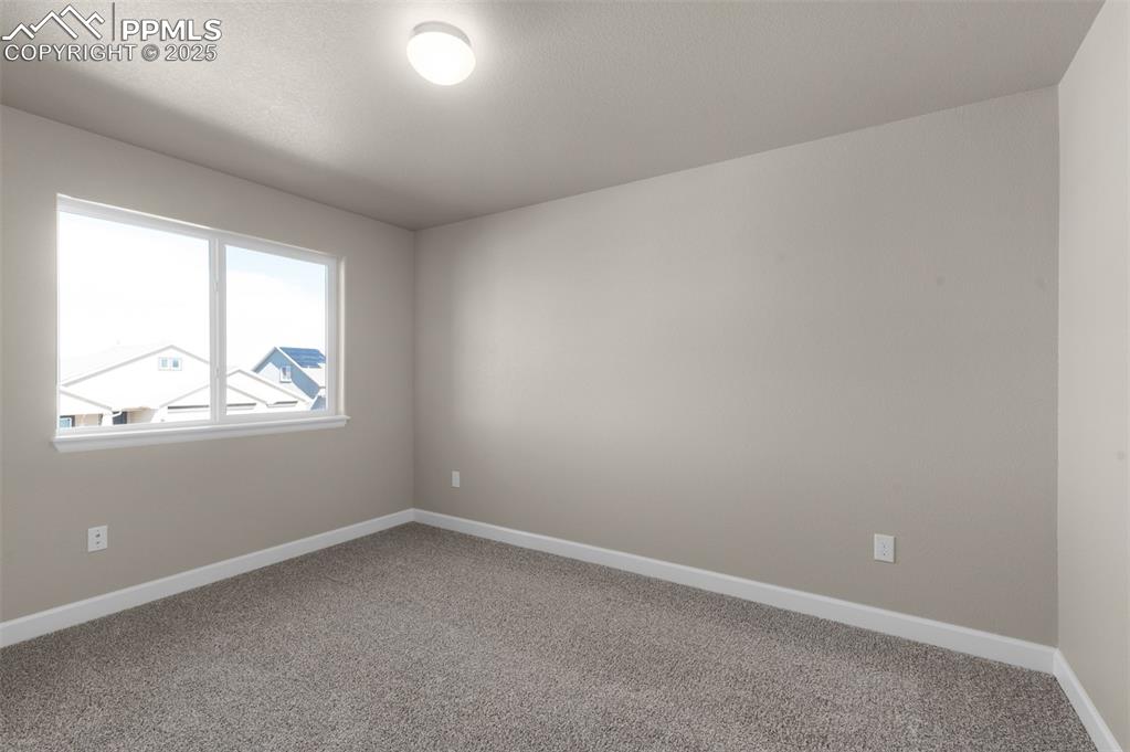Image 11 of 13: Spare room featuring carpet flooring and baseboards