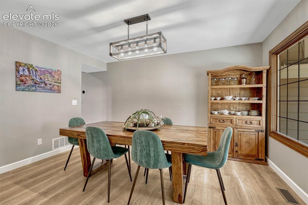 Image 18 of 49: Spacious eat in kitchen space with access to
your brand new deck. Don