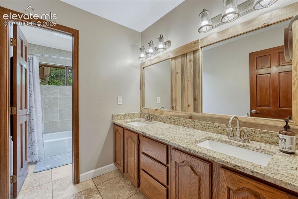 Image 27 of 49: Custom barn door, walk in closet and en suite bathroom
