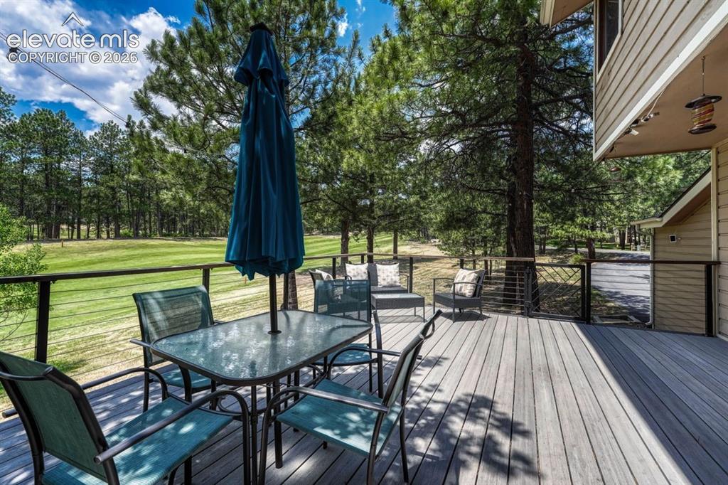 Image 5 of 49: Front porch sitting in the most amazing setting
