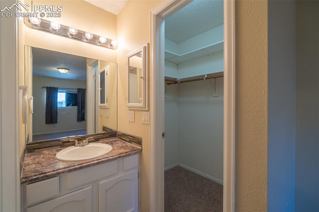 Image 20 of 42: Master bathroom on the upper level.  Featuring a walk in closet, separate v