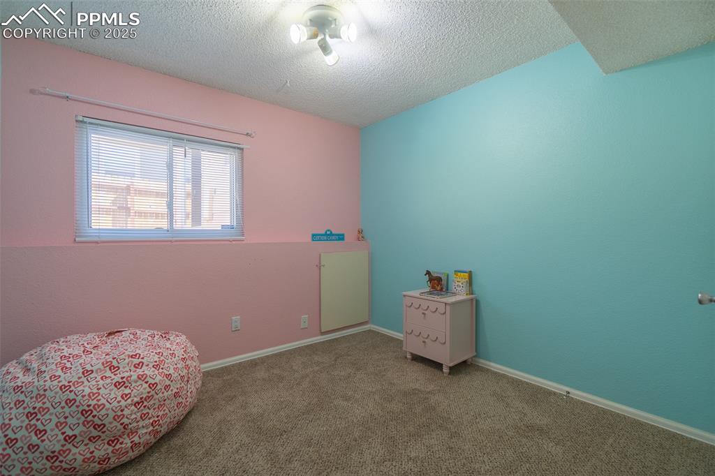 Image 27 of 42: Lower level bedroom