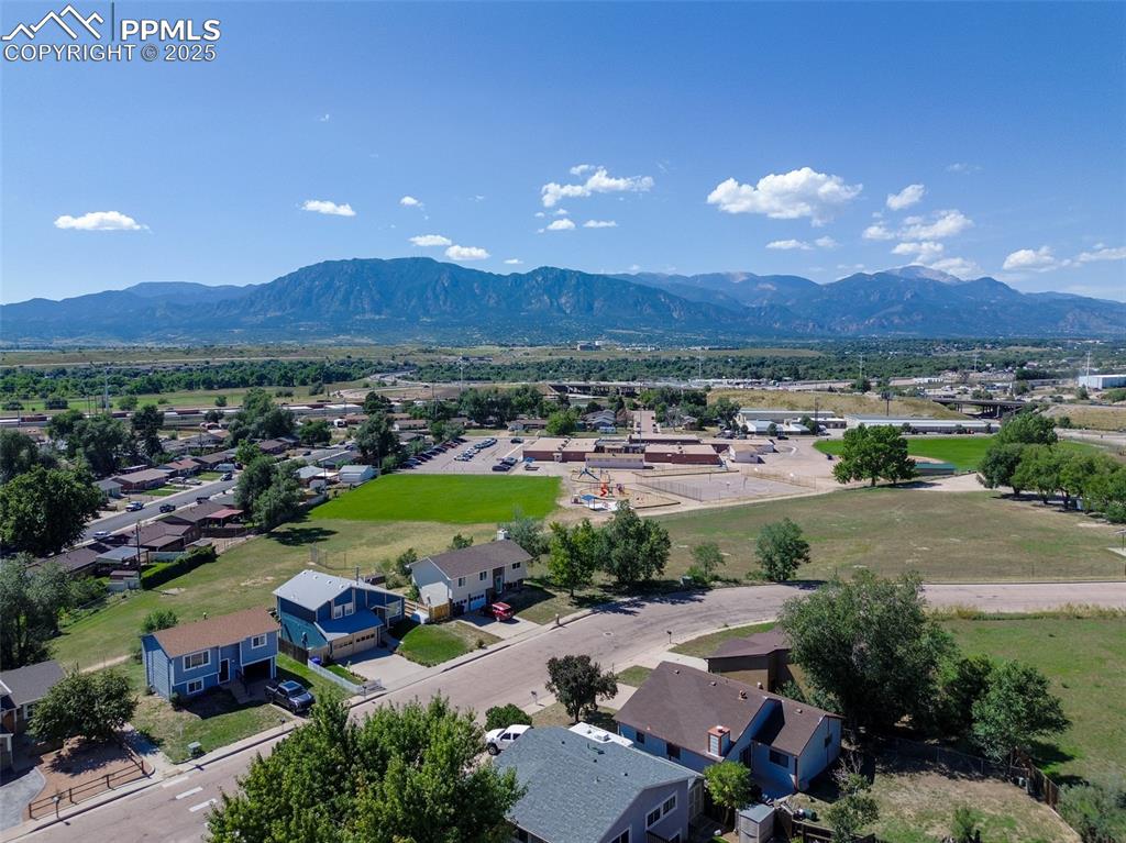 Image 4 of 42: Aerial perspective of suburban area with mountains