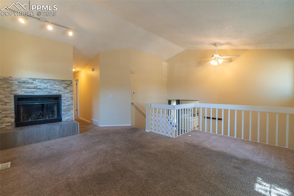 Image 6 of 42: Living room facing the wood burning fireplace.
