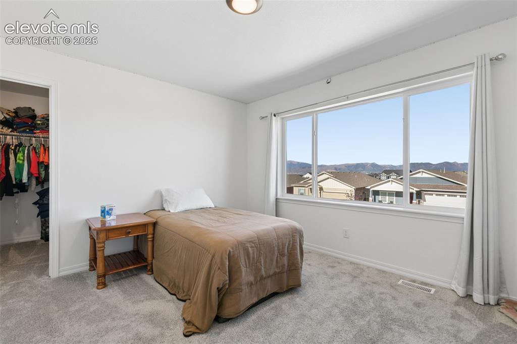 Image 14 of 26: Expansive window with mountain view backdrop