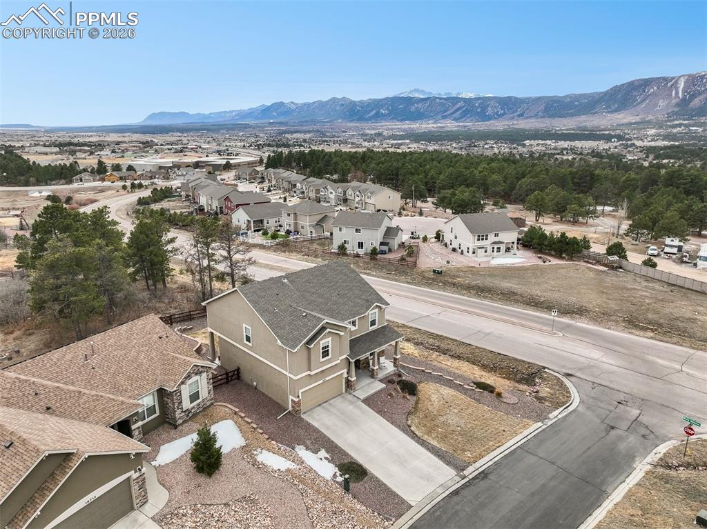 Caption: Aerial view of front of home with mountain views
