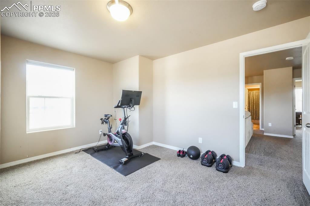 Image 38 of 50: Upstairs fourth bedroom with walk in closet, views of the mountains