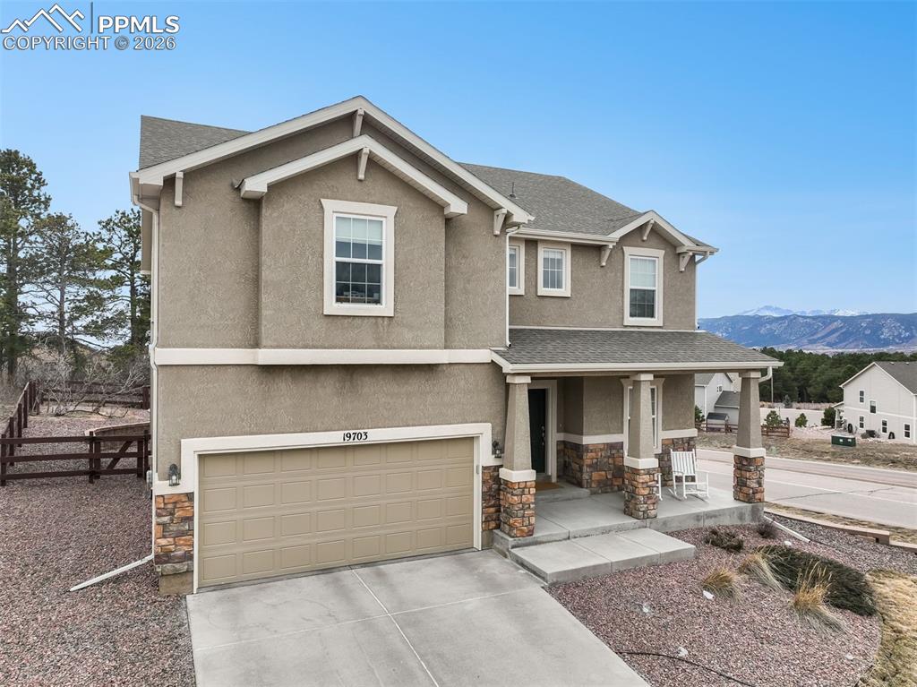 Image 49 of 50: ront of home with mountain views and long driveway