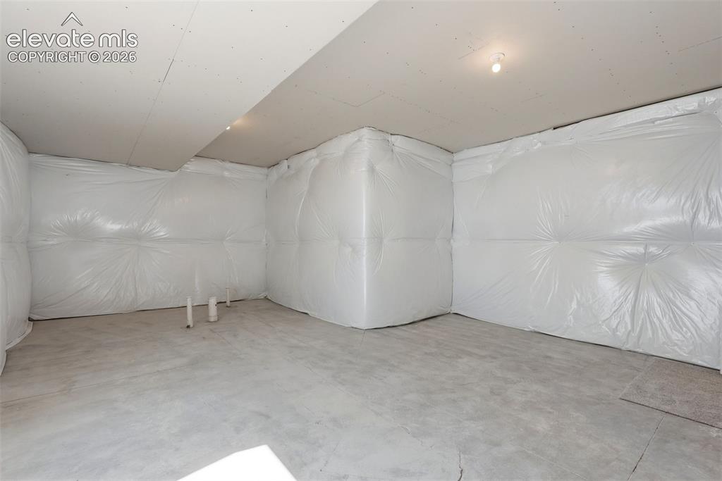 Image 34 of 39: Storage/Unfinished Guest Suite. Pre-plumbed for Bath