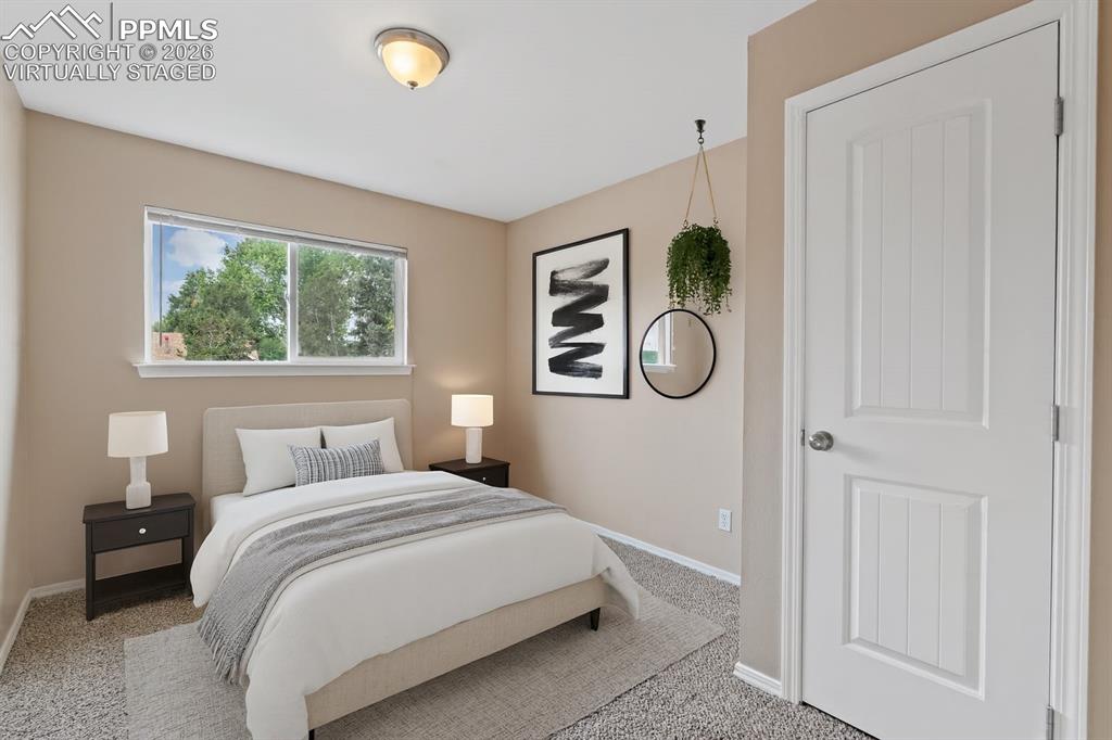 Image 24 of 40: Bedroom featuring carpet. virtually staged