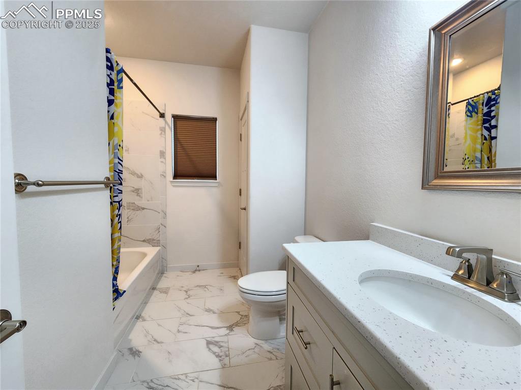 Image 24 of 31: Upstairs full bathroom with closet