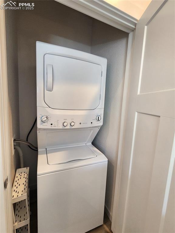 Image 25 of 31: Combo washer and dryer located upstairs.