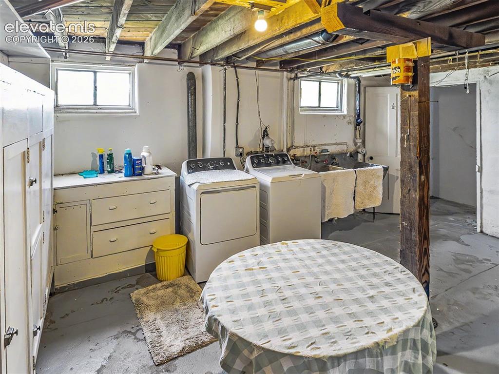 Image 16 of 27: Huge laundry area WITH laundry shoot from above and concrete