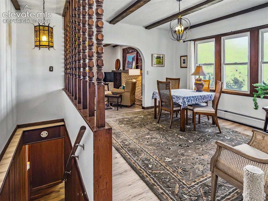 Image 5 of 27: Conveniently located between Kitchen and Living Room Large Exposed Beams in