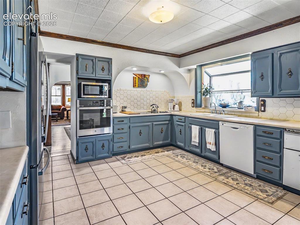 Image 6 of 27: Architectural features of mid-century kitchen blended seamlessly with moder