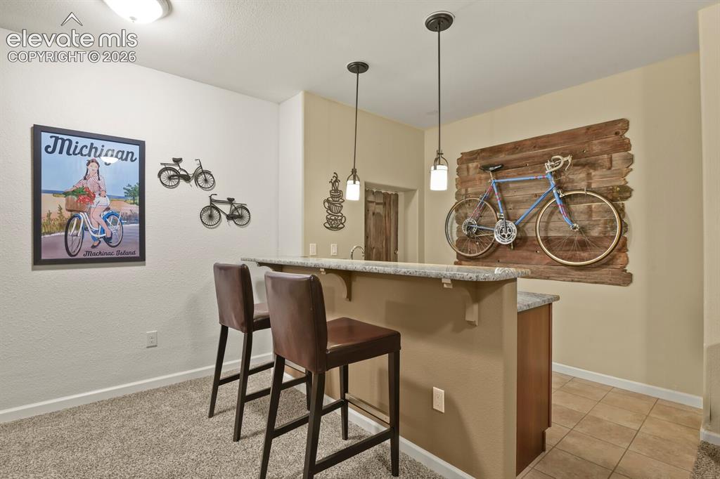 Image 29 of 47: Basement wet bar.