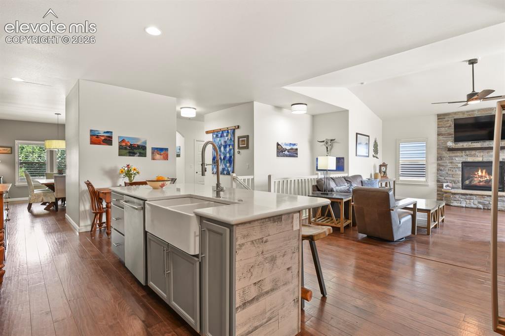 Image 3 of 47: Newly renovated kitchen with farm sink and quartz countertops.