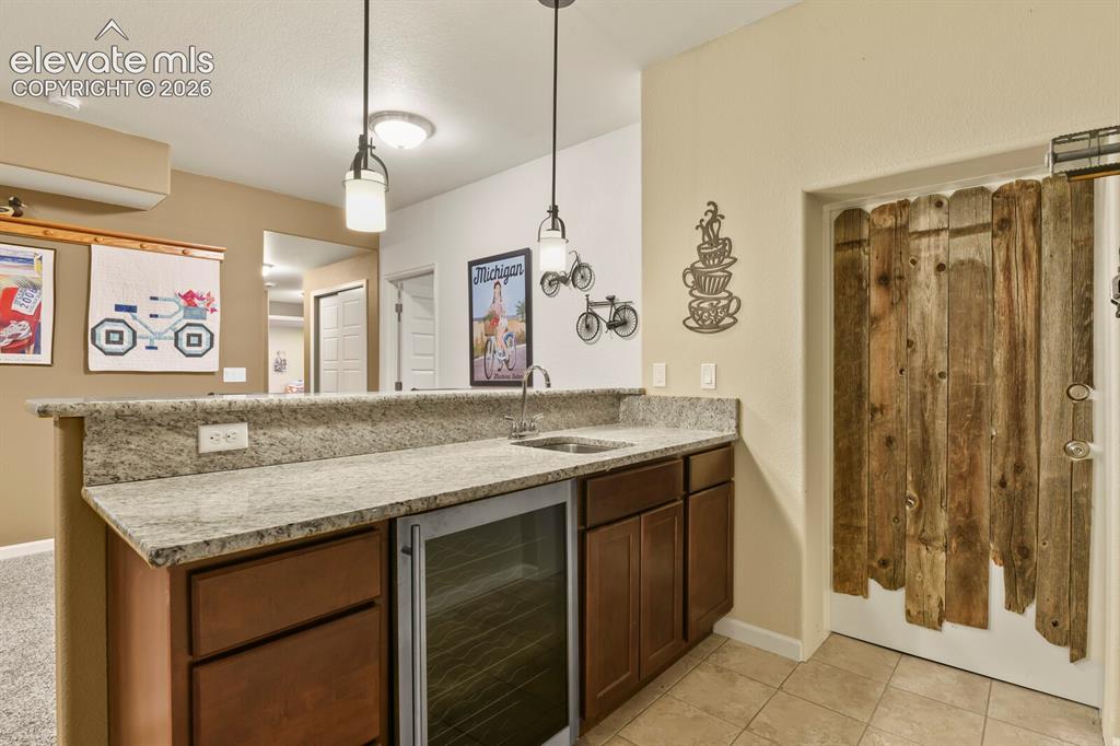 Image 30 of 47: Wet bar includes the wine fridge.