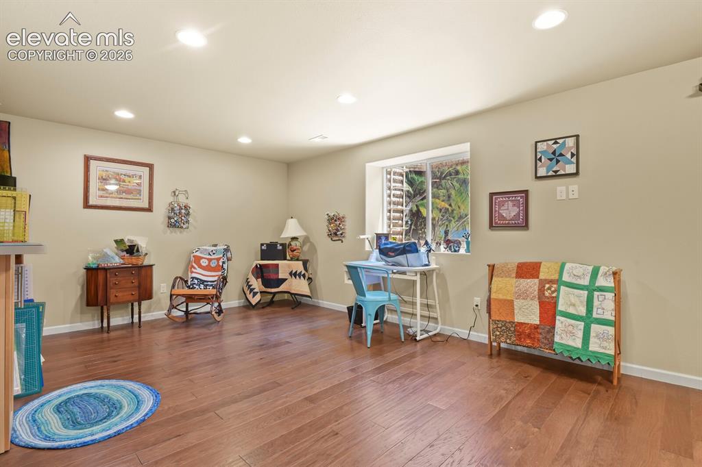 Image 34 of 47: Large 3rd bedroom in basement with wood floors and walk in closet.