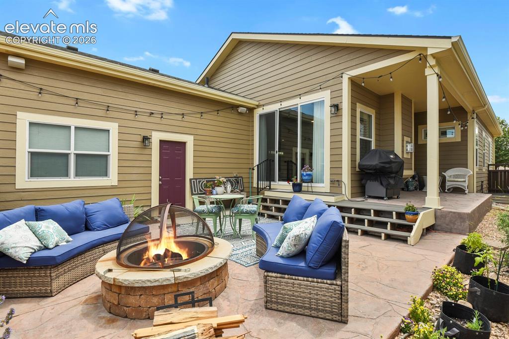 Image 42 of 47: Built in Gas fire pit on back patio.