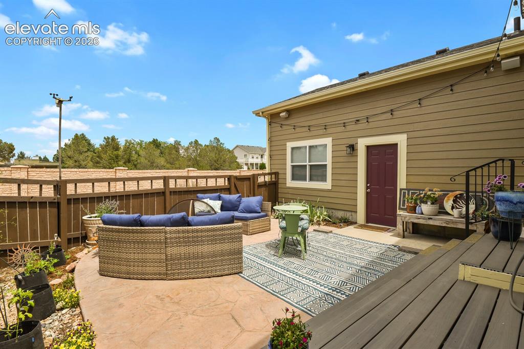 Image 43 of 47: Waterproof outdoor speakers also a part of this fabulous back patio.