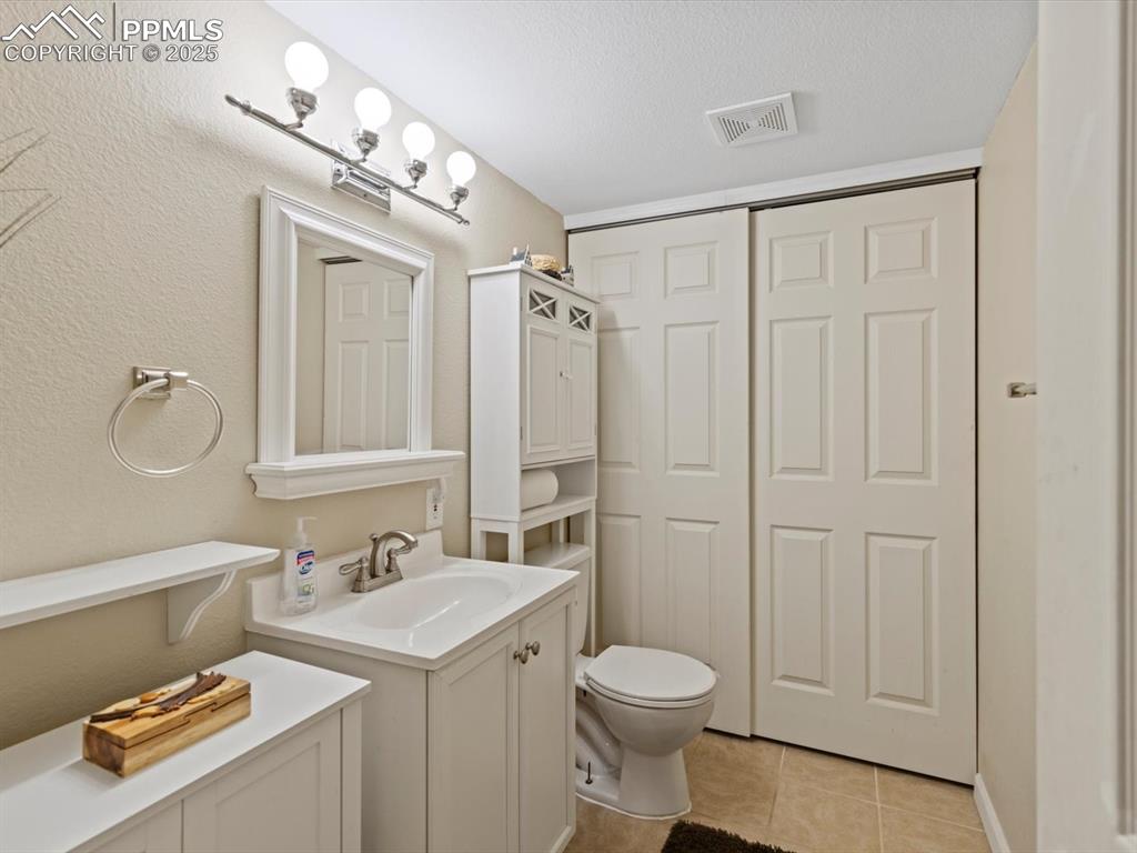 Image 38 of 42: Half bath in basement