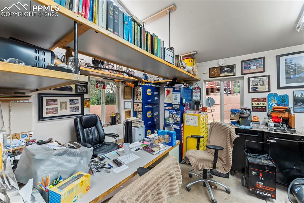 Image 13 of 42: Office area with plenty of natural light and storage 