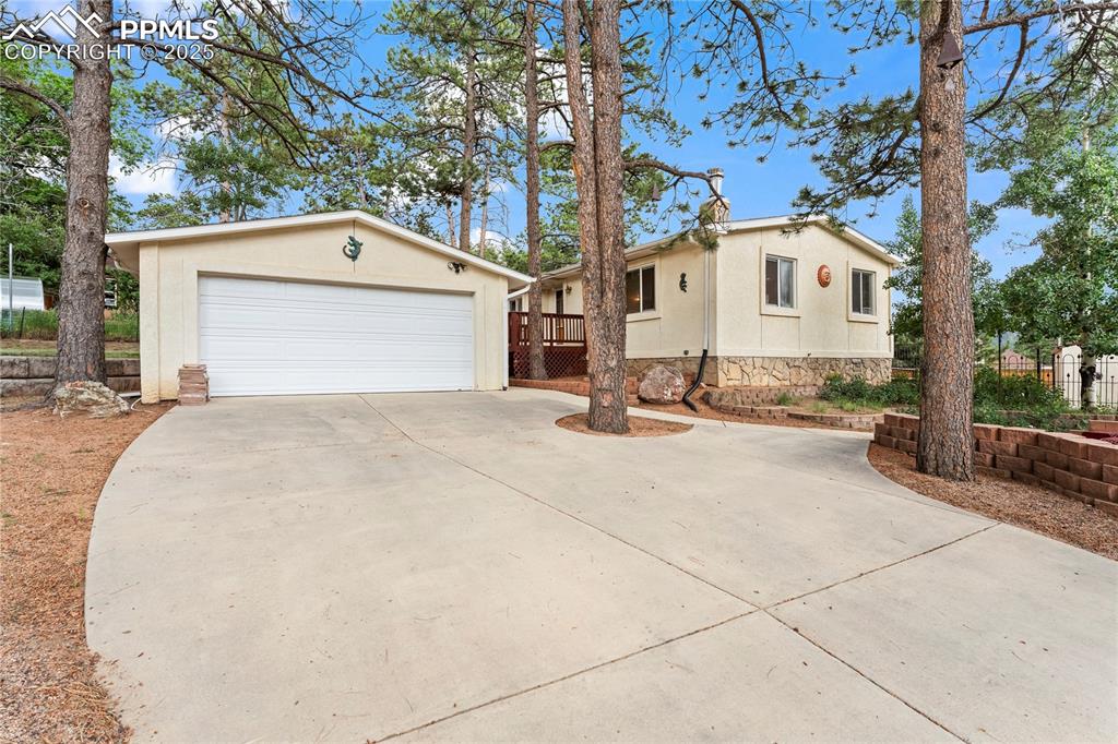 Image 14 of 42: Main level living Raised Ranch-style home featuring a detached 2 car garage