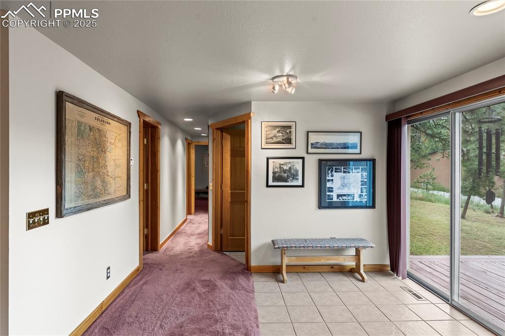 Image 24 of 42: Sliding glass door to back deck