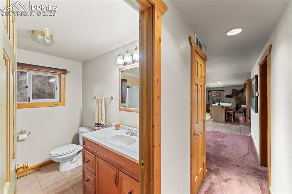 Image 28 of 42: Full bathroom with a shower tub combo