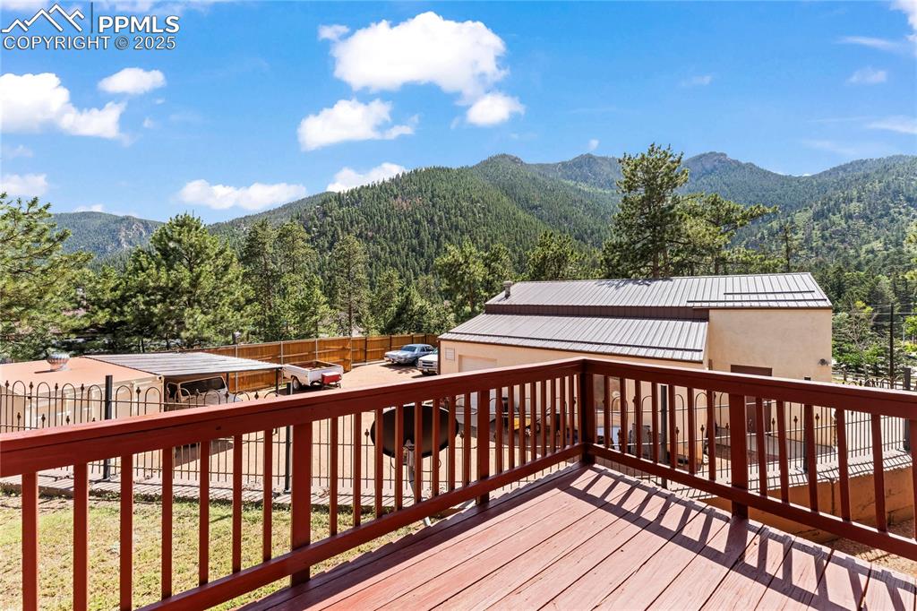 Image 37 of 42: Back deck with a mountain view