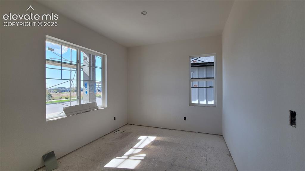 Image 5 of 30: French Doors into the office on the main level! Please, excuse our dust as 