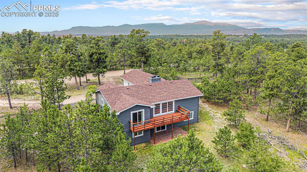 Caption: Pikes Peak Views on a treed lot!