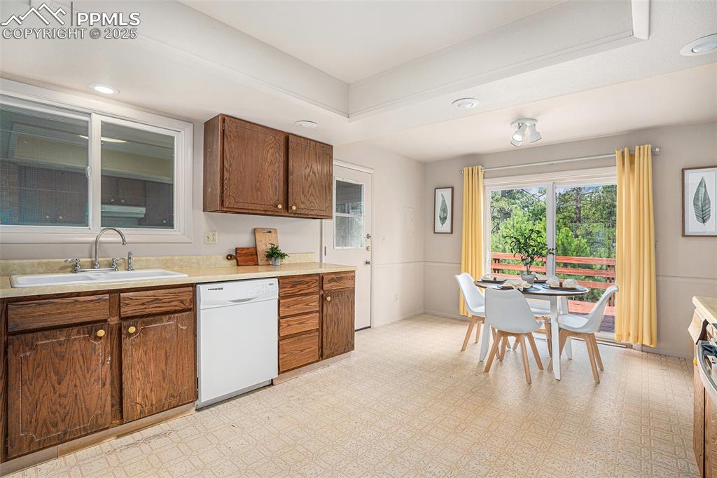 Image 6 of 34: Eat-in kitchen and walkout to the deck!