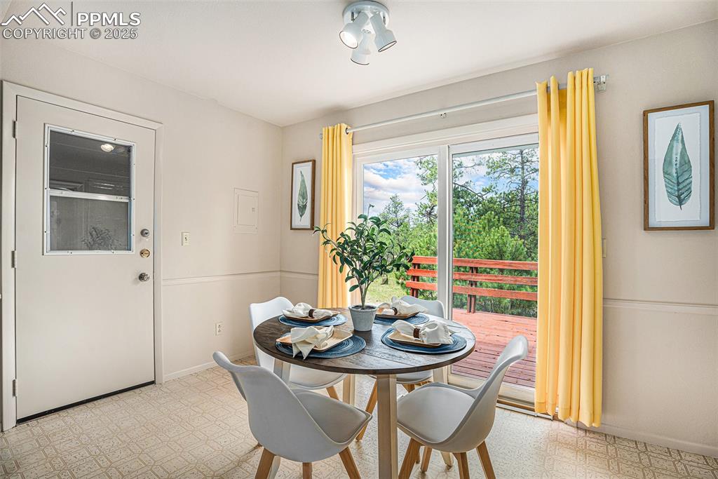 Image 7 of 34: Eat-in kitchen with walkout to huge deck!