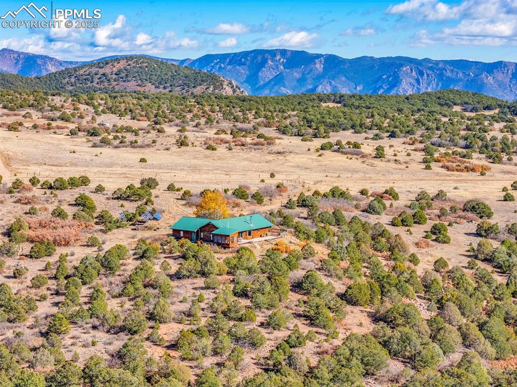 Image 46 of 50: Overview of rural landscape featuring a mountainous background