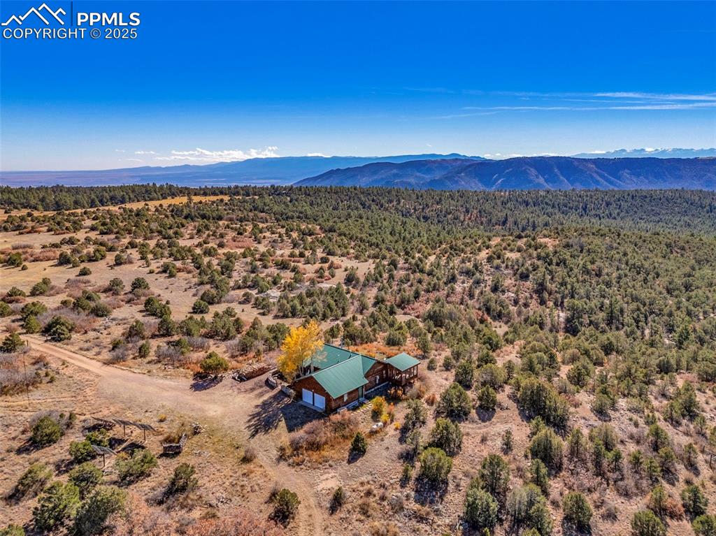 Image 49 of 50: View of subject property featuring a mountainous background