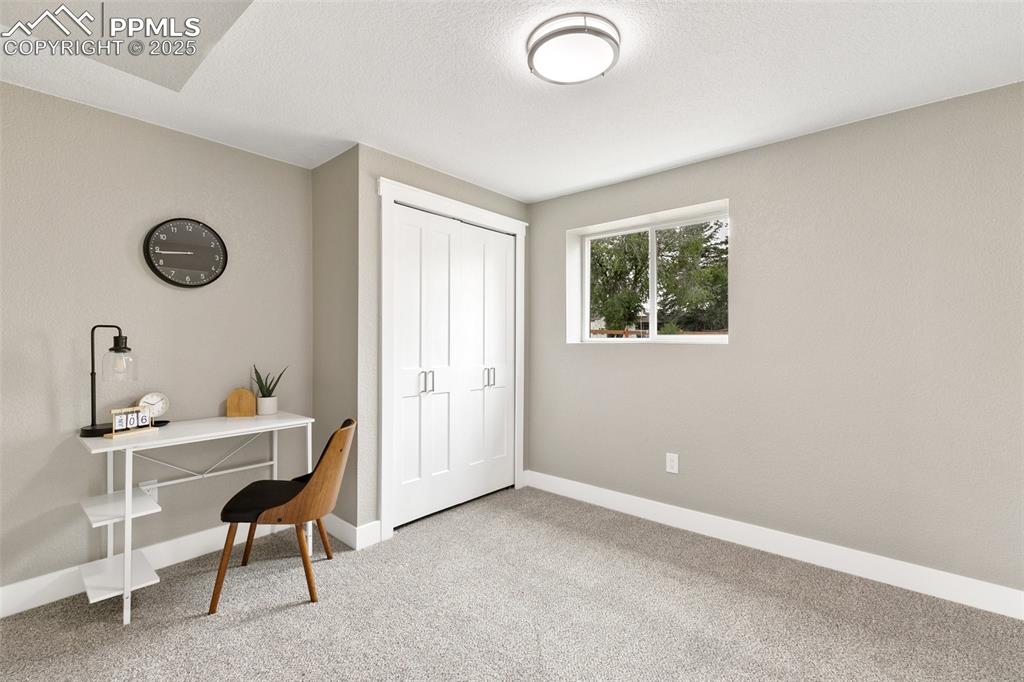 Image 11 of 18: Home office featuring carpet floors and baseboards