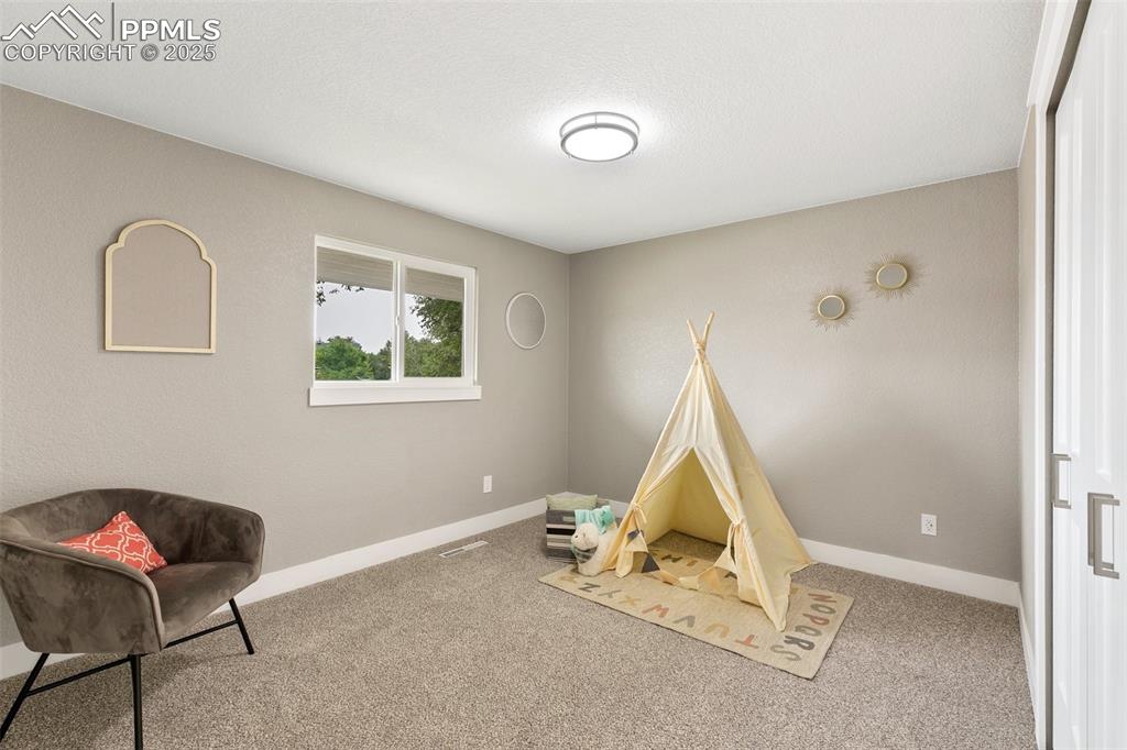Image 13 of 18: Recreation room featuring carpet flooring