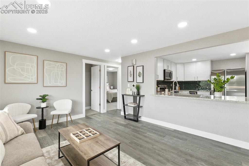 Image 3 of 18: Living area featuring recessed lighting and light wood-type flooring