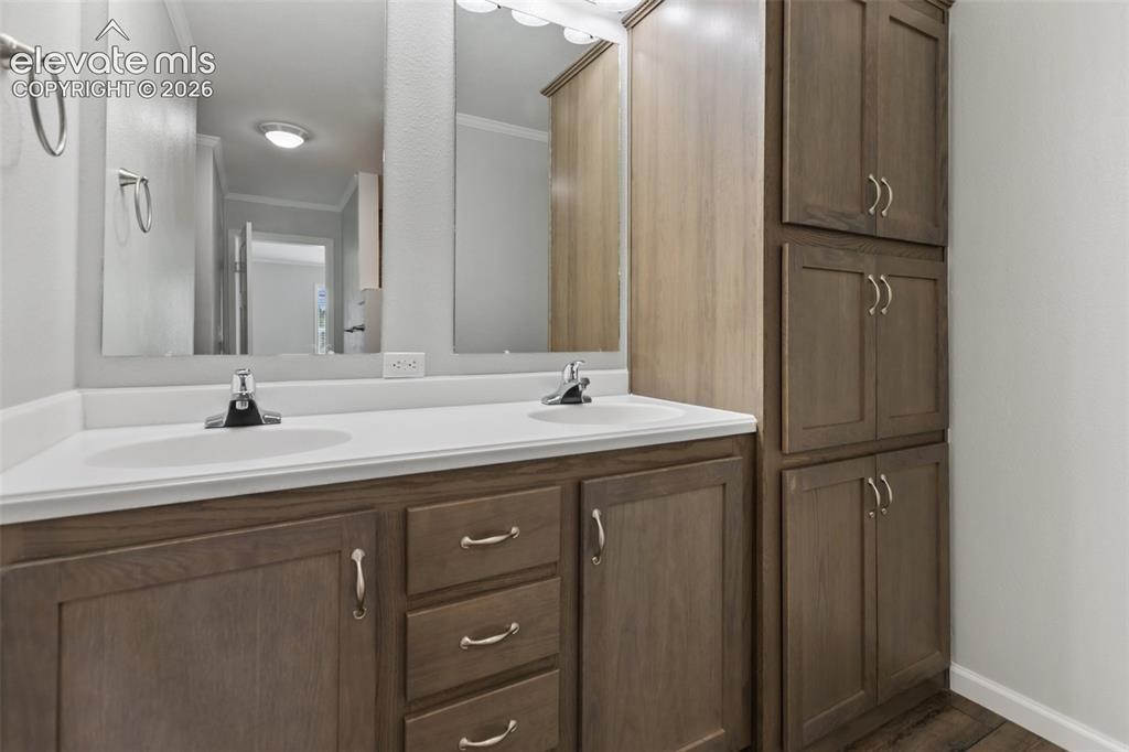 Image 19 of 45: Primary Bathroom double vanity