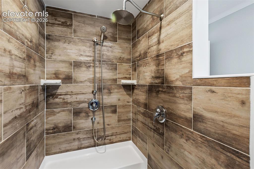 Image 22 of 45: Primary Bathroom with double oversized shower. Spa like rain shower and be