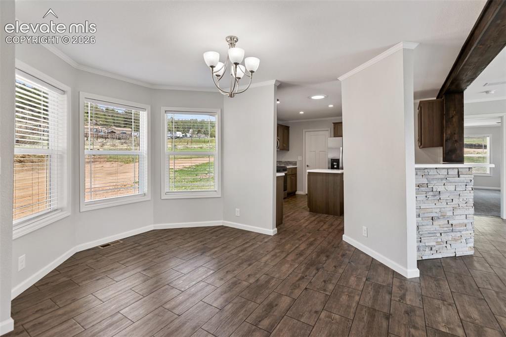 Image 3 of 45: Dining room and kitchen