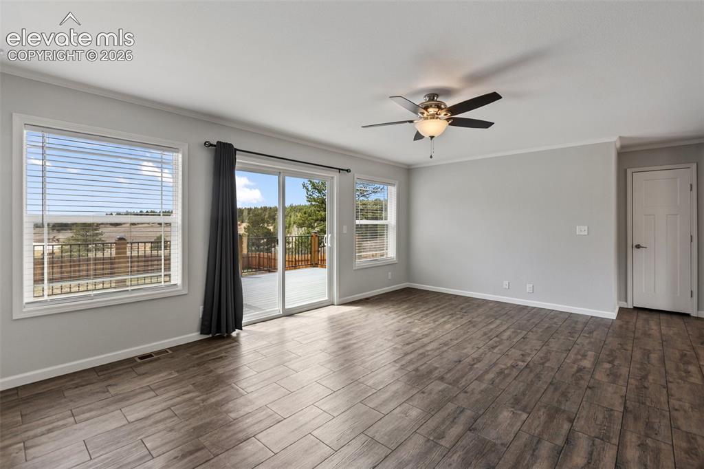 Image 6 of 45: Living room and back deck