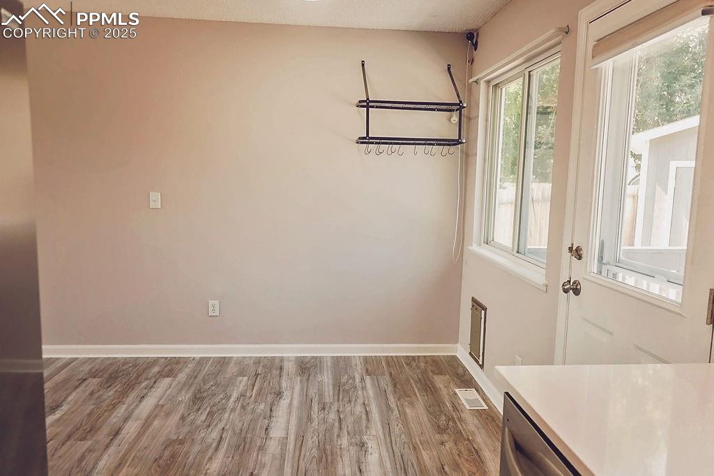 Image 11 of 38: Kitchen Looking Towards Eat-In & Walk-Out to Backyard
