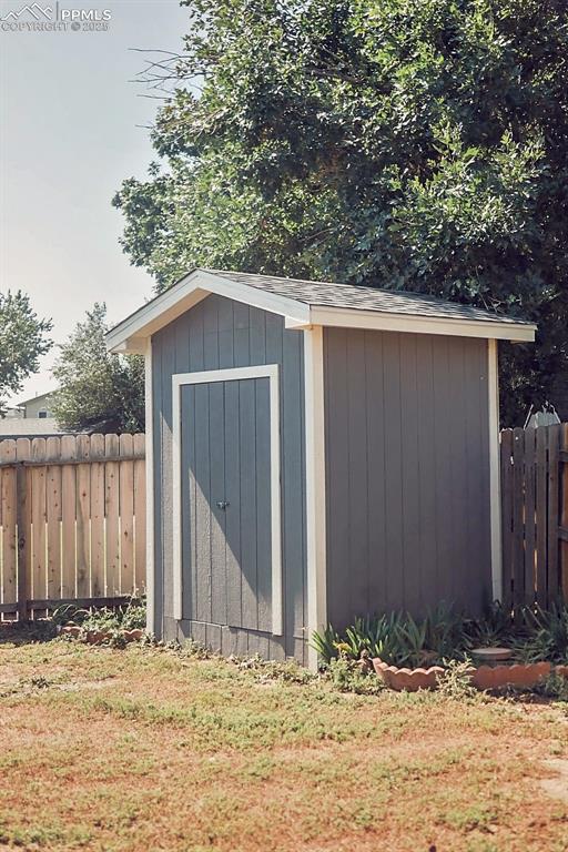 Image 38 of 38: Larger Storage Shed in Backyard