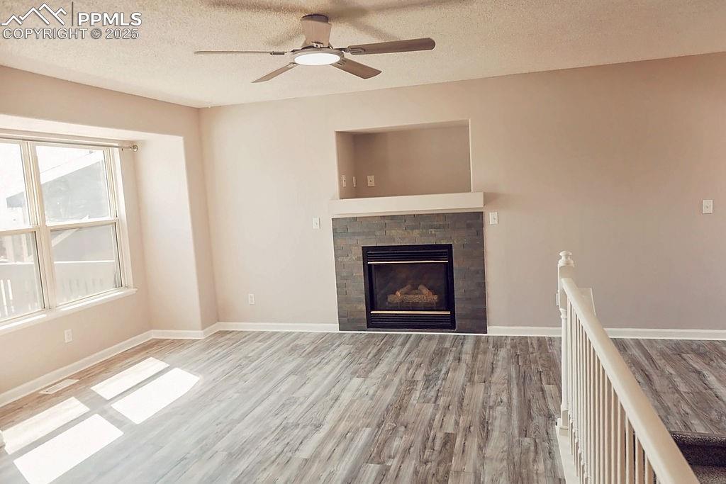 Image 6 of 38: Living Room with Gas Fireplace