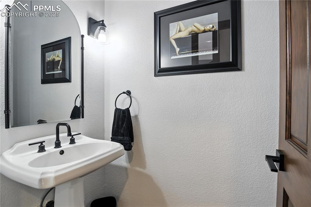 Image 32 of 50: Main floor half bath